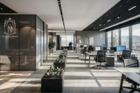 Open-plan office with workstations, dark glass meeting room, planters and panoramic city and mountain views